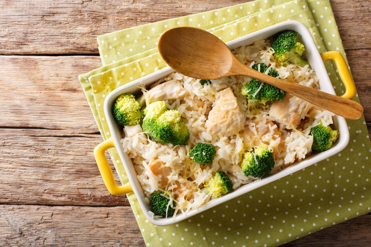 Dietary foods: rice baked with broccoli, chicken and cheese close-up. Horizontal top view